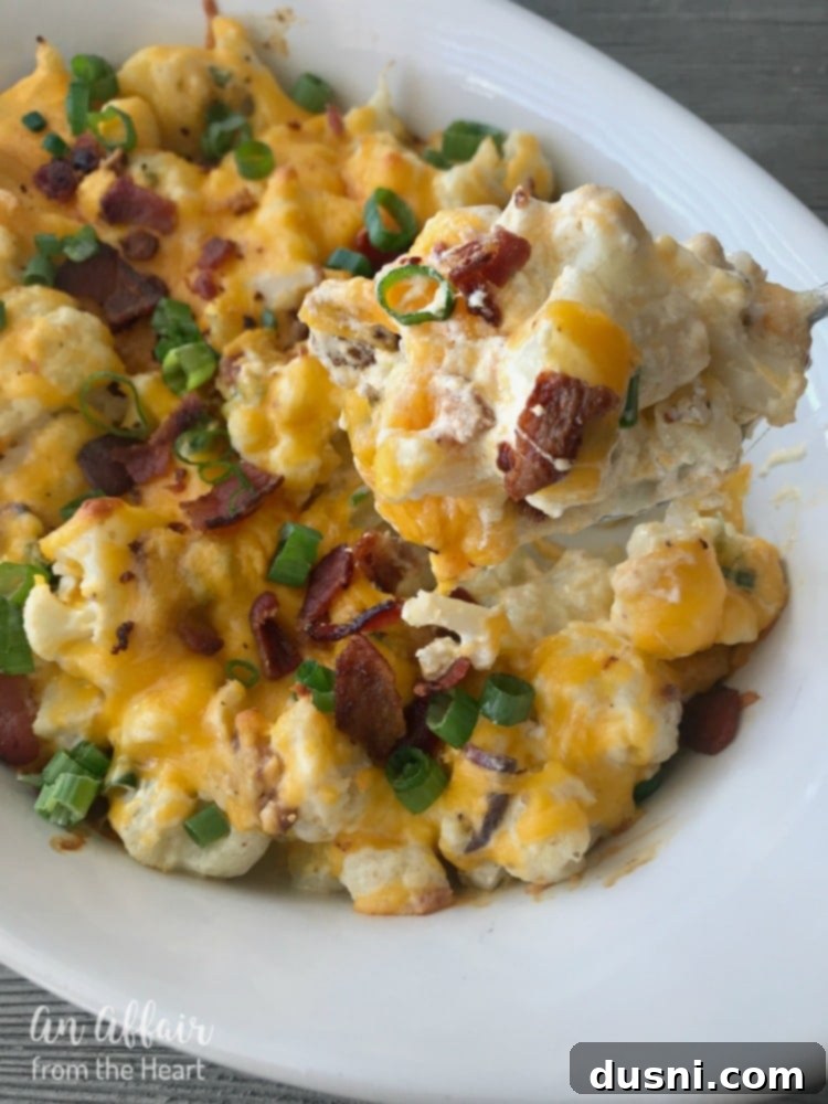 Loaded Cauliflower Casserole - A hearty, cheesy, low-carb casserole recipe with bacon and green onions, perfect for a healthy side dish or main meal.