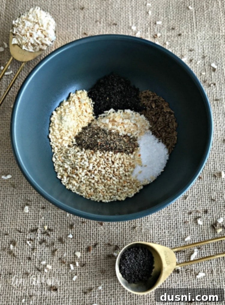 Everything Bagel Spice displayed in a ceramic bowl, showing the texture and variety of the ingredients up close.