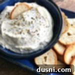 Whip Up Your Own Everything Bagel Dip 9 Everything Bagel Dip in a blue bowl