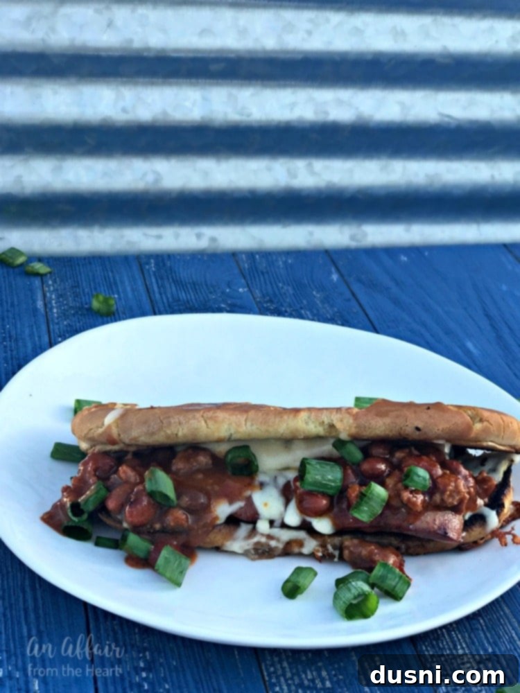 Fiery Chili Cheese Dog Melt 2 Spicy Grilled Cheese Chili Dogs, gooey pepper jack cheese, warm spicy chili, and fresh green onions on a grill-toasted bun