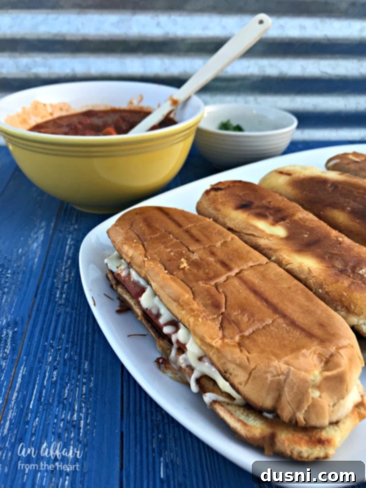 Fiery Chili Cheese Dog Melt 10 Plated Spicy Grilled Cheese Chili Dog topped with chili and green onions