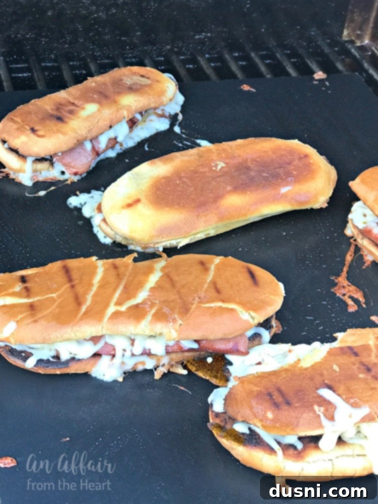 Fiery Chili Cheese Dog Melt 9 Folding the top bun over the cheese-laden hot dog on the grill