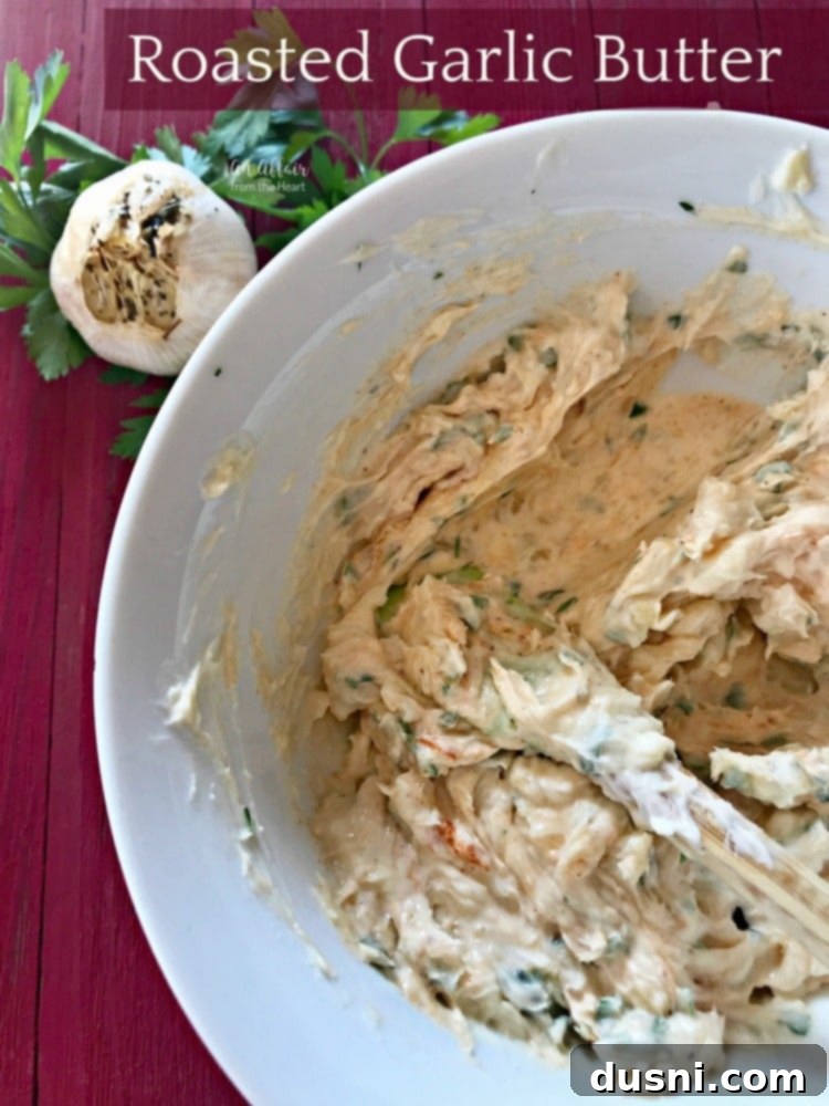 Golden Roasted Garlic Butter 9 A bowl of roasted garlic butter with fresh herbs, ready for use, embodying homemade goodness.