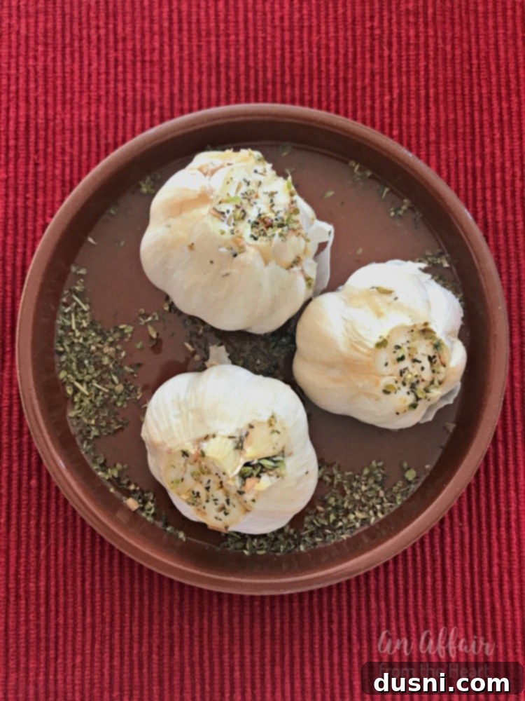 Golden Roasted Garlic Butter 4 Whole garlic bulbs, ready for roasting, showcasing their natural beauty.