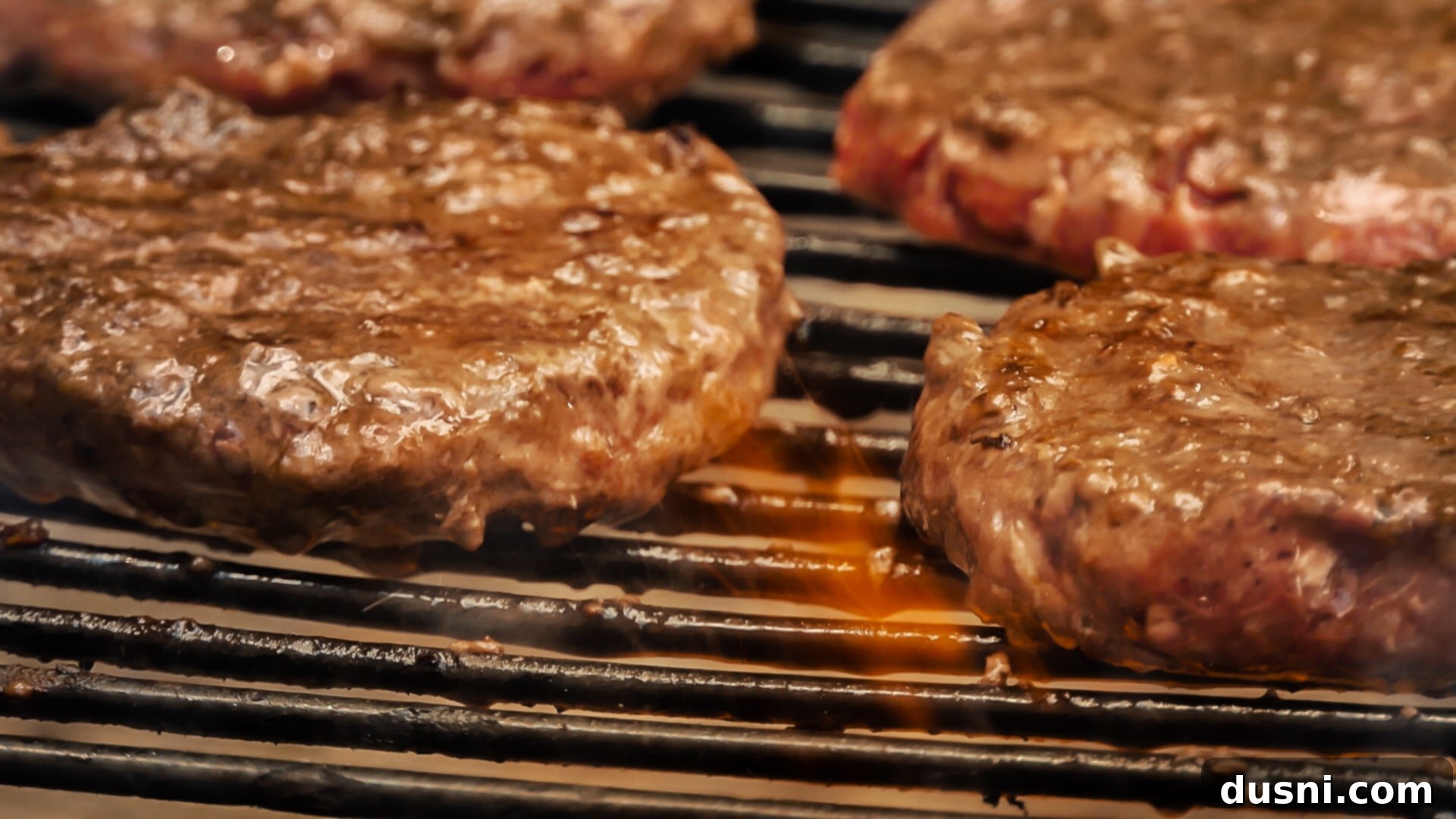 Grill It Up with Franks Tangy Kraut 5 Juicy burgers sizzling on the grill