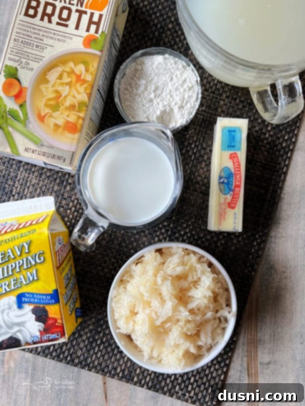 Closeup of creamy sauerkraut, bratwurst, and potato soup