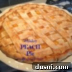 Close up of Whiskey peach pie with text of the same