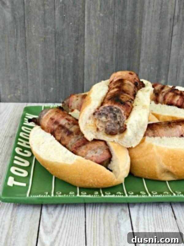 Kraut Stuffed Bacon Wrapped Brats for Tailgating - close up on a festive plate