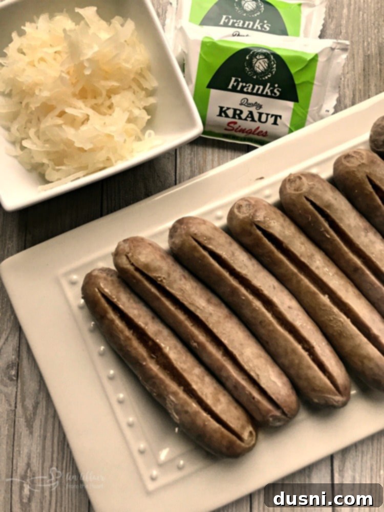 Kraut Stuffed Bacon Wrapped Brats - brats prepped and ready for the grill