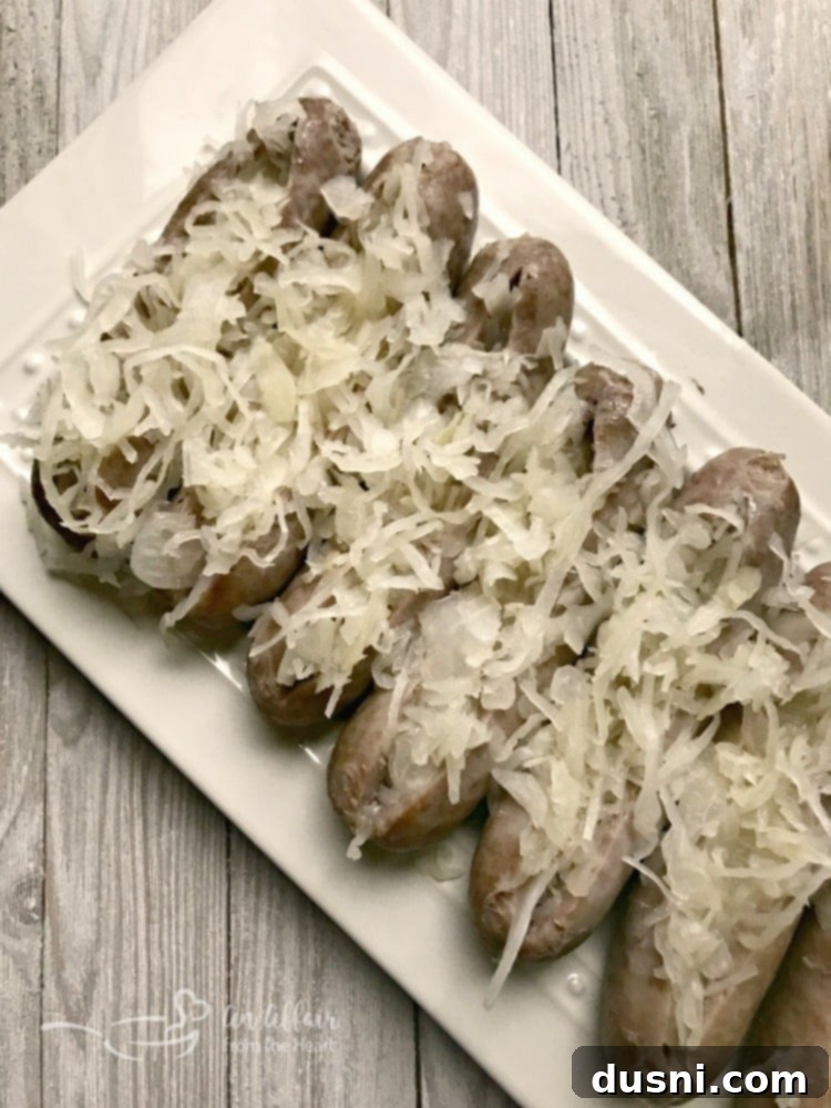 Kraut Stuffed Bacon Wrapped Brats - stuffed with tangy Frank's Kraut