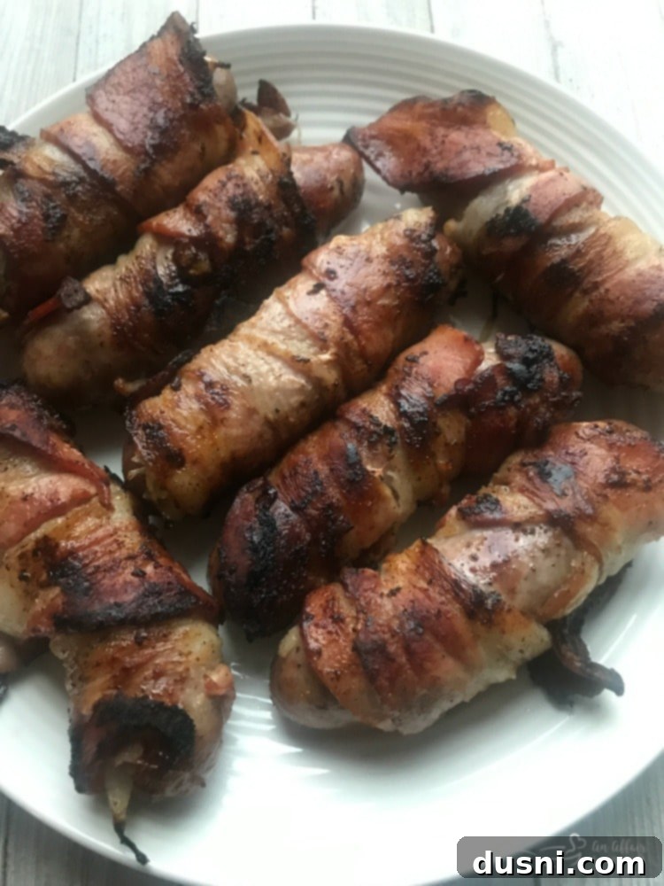 Kraut Stuffed Bacon Wrapped Brats plated beautifully