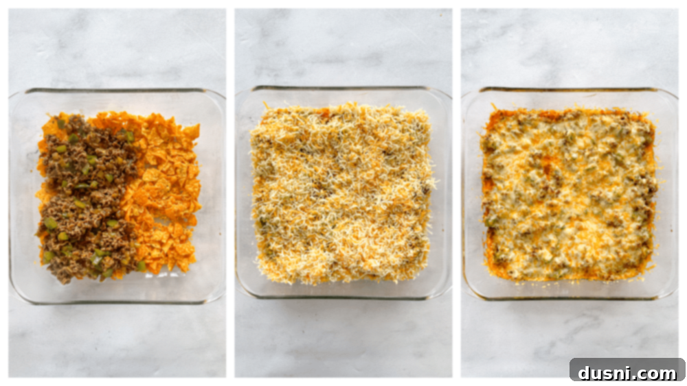 Close up shot of ground beef mixture with green chiles and seasoning simmering in a skillet, showcasing the rich color and texture.