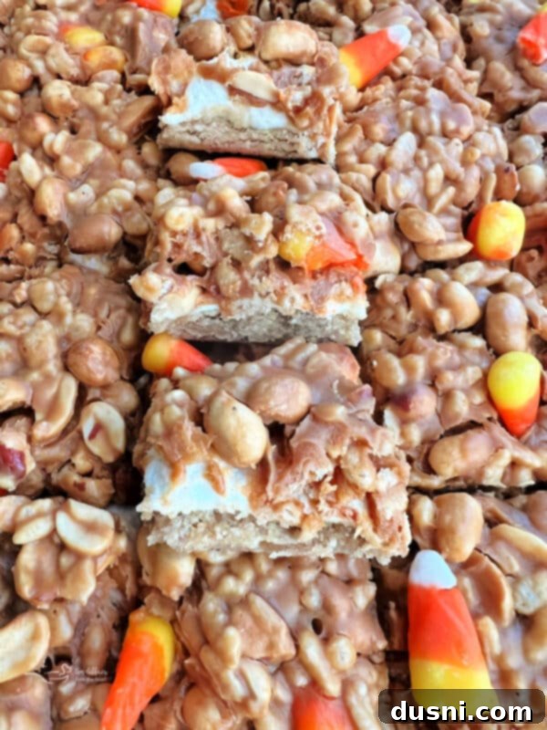 Candy Corn Salted Nut Roll Bars with candy corn sprinkled on top
