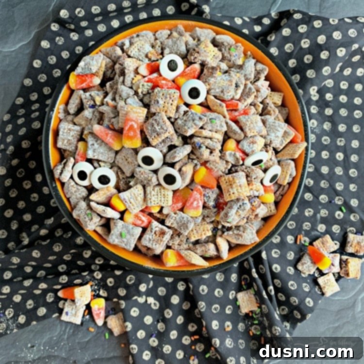 Overhead of Halloween Double Peanut Butter Muddy Buddies in a halloween bowl