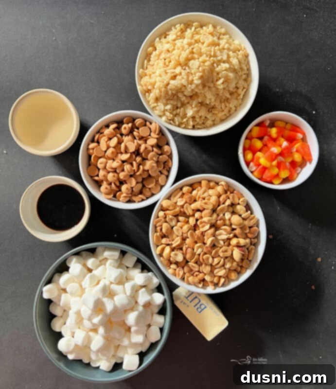 Individual ingredients for Candy Corn Salted Nut Roll Bars laid out
