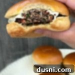 Spicy Bacon Kraut Burger bite out of it