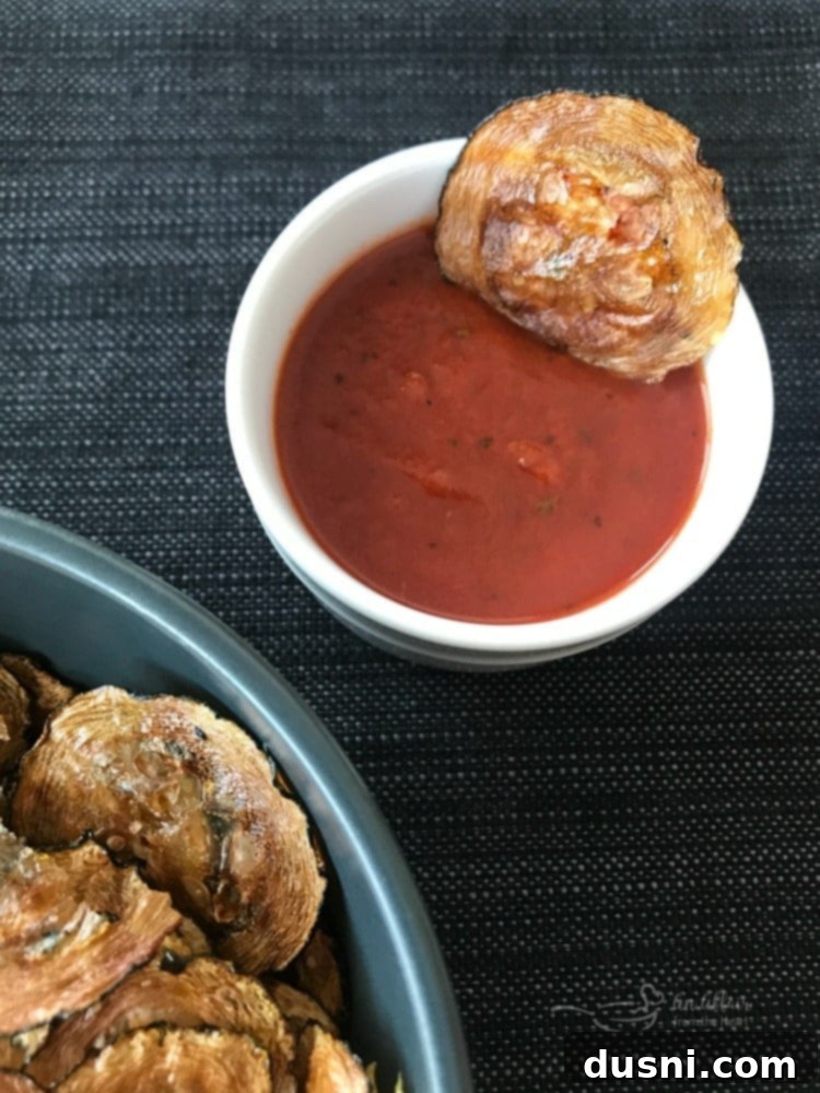 Italian Style Baked Zucchini Chips dipped in marinara sauce