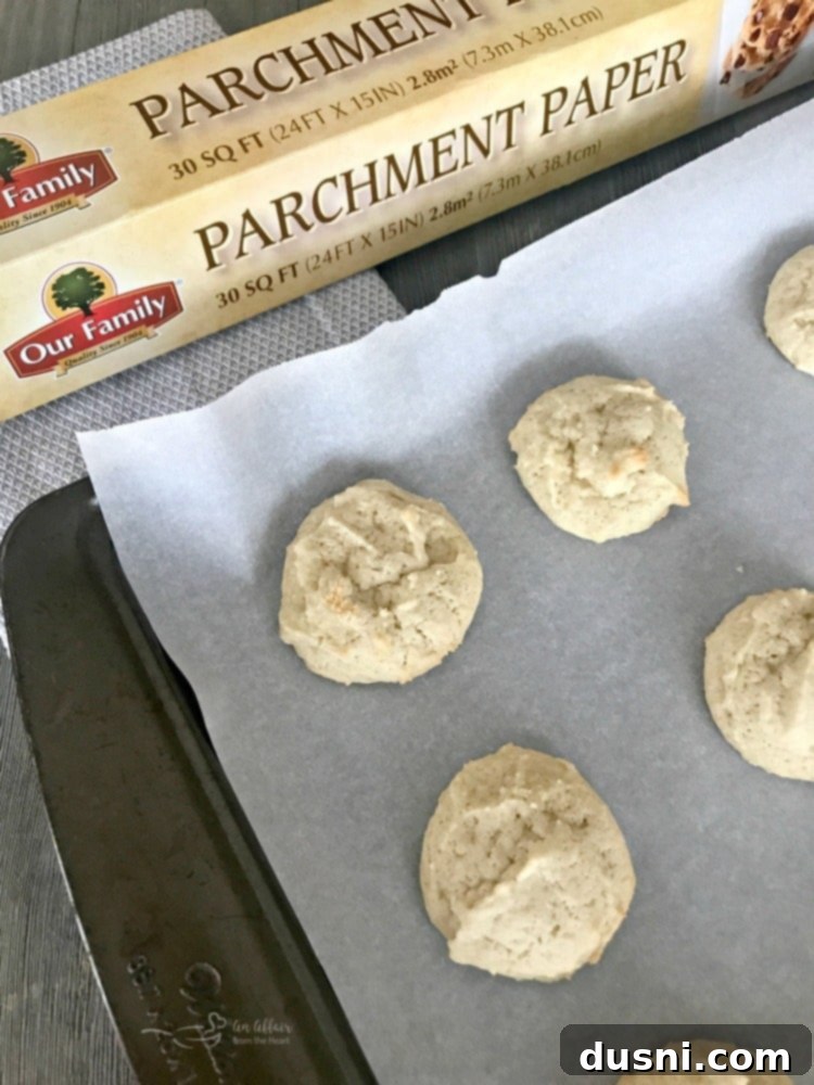 Homestyle Frosted Sour Cream Sugar Cookies 9 Old Fashioned Frosted Sour Cream Sugar Cookies with parchment