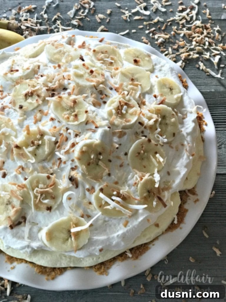 Full Banana Cream Pie on a rustic table