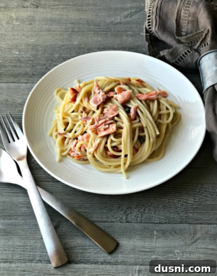 Savory Smoked Salmon Pasta 6 Smoked Salmon Pasta - A full plate of smoked salmon pasta, elegantly presented and ready to eat.