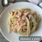 Savory Smoked Salmon Pasta 8 Smoked Salmon Pasta on a white plate