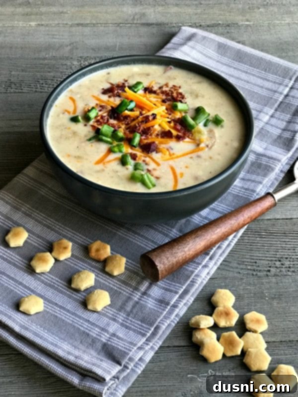 Hearty Instant Pot Loaded Potato Soup with red and gold baby potatoes