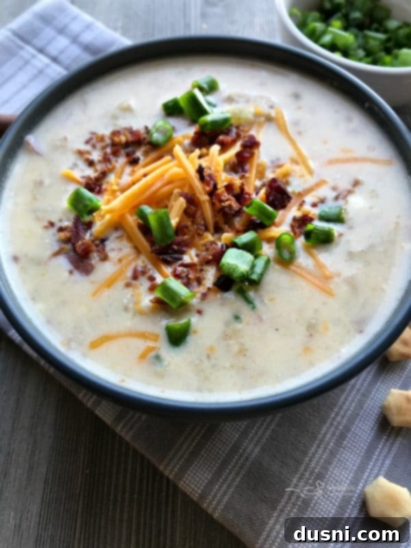 Close-up of rich and creamy Instant Pot Loaded Potato Soup with bacon and cheese