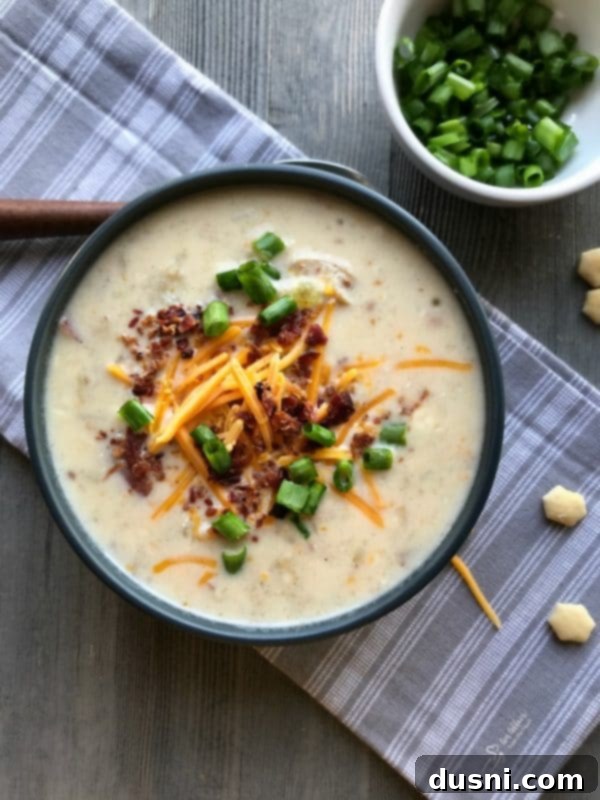 Delicious Instant Pot Loaded Potato Soup garnished with fresh green onions