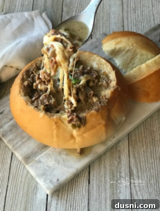 Loaded Philly Cheesesteak Soup 7 Philly Cheese Steak Soup in a bread bowl with cheese pull
