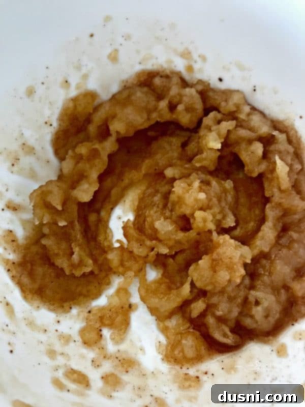 Homemade Dairy Queen Apple Pie Blizzard 10 Pureed baked apple, made using an immersion blender, cooling in a bowl for the Copycat Dairy Queen Apple Pie Blizzard.