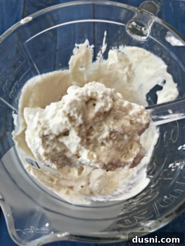 Homemade Dairy Queen Apple Pie Blizzard 11 Fresh heavy whipping cream being whipped to stiff peaks with an immersion blender's beater attachment.