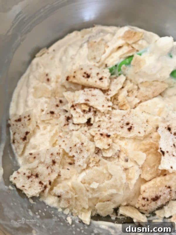 Homemade Dairy Queen Apple Pie Blizzard 14 Broken pieces of cinnamon pie crust folded into the apple blizzard mix, completing the homemade Dairy Queen dessert.