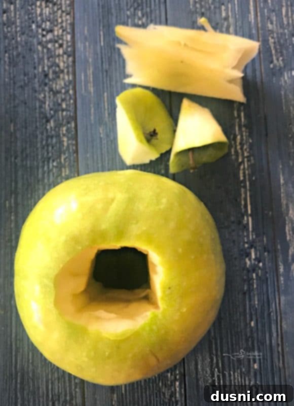 Homemade Dairy Queen Apple Pie Blizzard 6 Peeled and cored Granny Smith apple, ready for baking, a key component for the Copycat Apple Pie Blizzard.