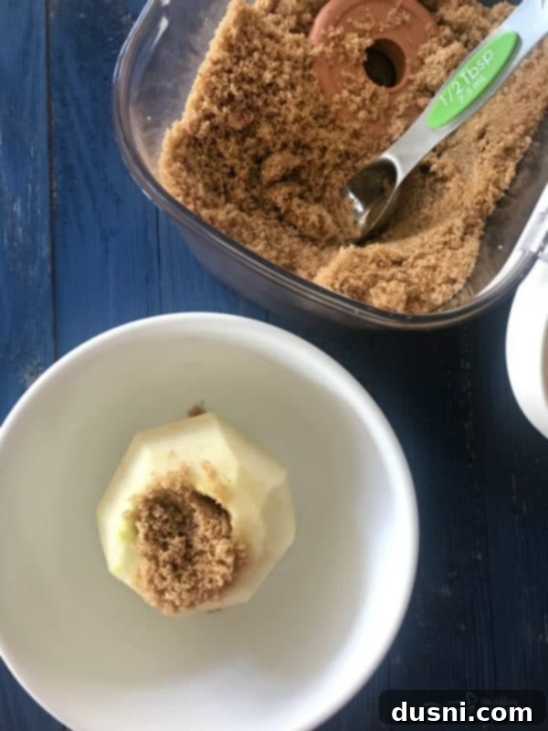 Homemade Dairy Queen Apple Pie Blizzard 7 Cored and peeled Granny Smith apple in a bowl with brown sugar, ready for microwaving to tender perfection.