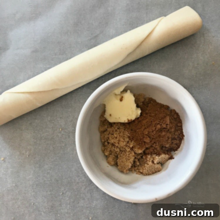 Pumpkin Spice Pie Crust Swirls 5 Mixing butter, brown sugar, and pumpkin pie spice in a bowl for the cookie filling