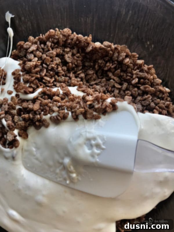 Melting butter and marshmallows in a saucepan