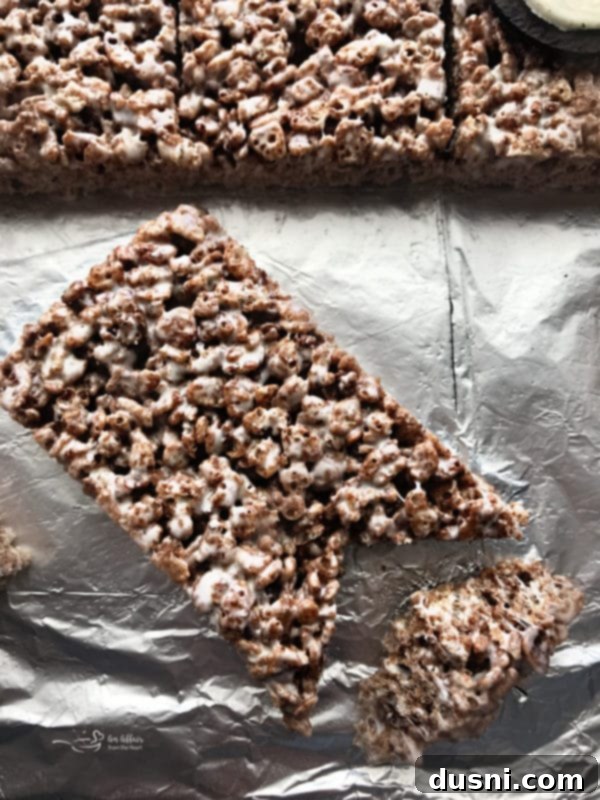Cutting Cocoa Krispies treats into rectangles with ear notches