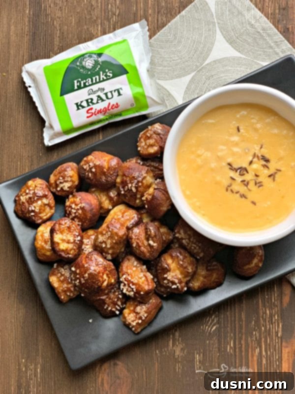 Cheesy Sauerkraut Pretzel Poppers 4 Serving Quick Pretzel Bites with Sauerkraut Cheddar Cheese Sauce, showcasing the vibrant dip
