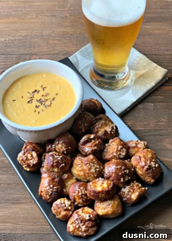 Cheesy Sauerkraut Pretzel Poppers 6 Pretzel Bites ready to be dipped in Sauerkraut Cheddar Cheese Sauce