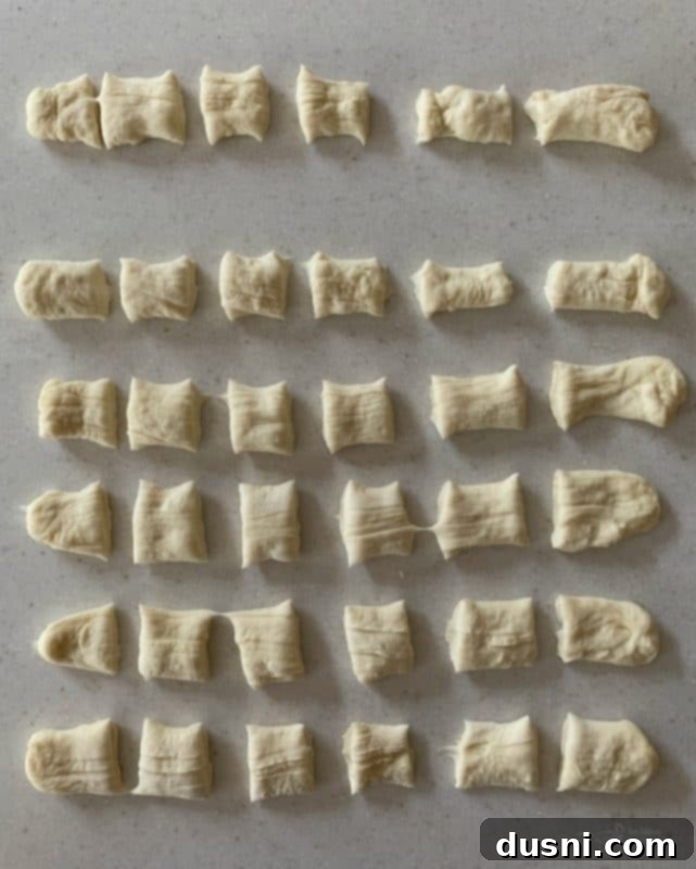 Cheesy Sauerkraut Pretzel Poppers 8 Stretching out frozen bread dough rolls for pretzel bites