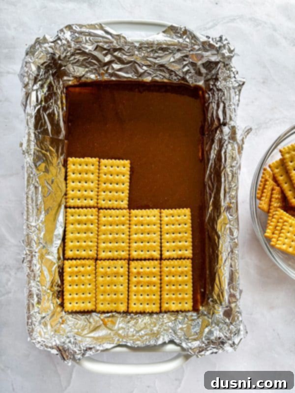 Homemade Caramel Shortbread Chocolate Bars 7 Cooking caramel mixture in a saucepan