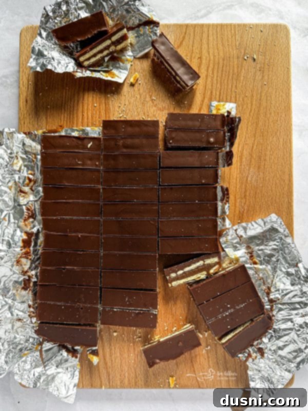 Homemade Caramel Shortbread Chocolate Bars 10 Pouring melted chocolate mixture over the bars