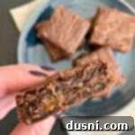 A delicious Double Chocolate Caramel Brownie with a bite taken out