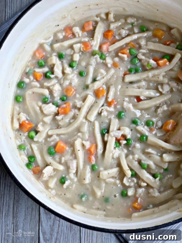 Combining noodles with chicken and gravy