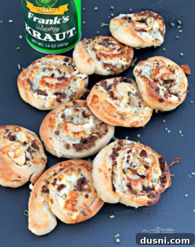 Delicious Steak & Kraut Pinwheels with Golden Caramelized Onions and Melted White Cheddar Cheese, served warm as an appetizer