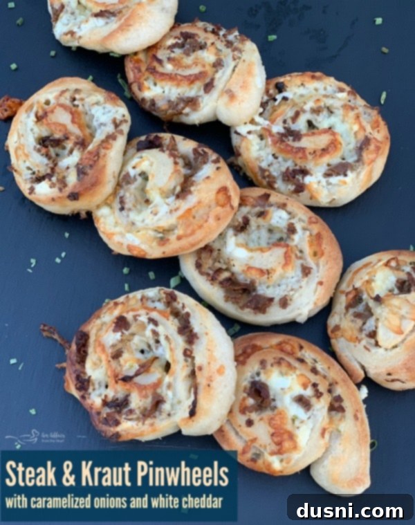 Fully assembled Steak & Kraut Pinwheels, showing the spiral of dough, steak, kraut, and cheese before baking