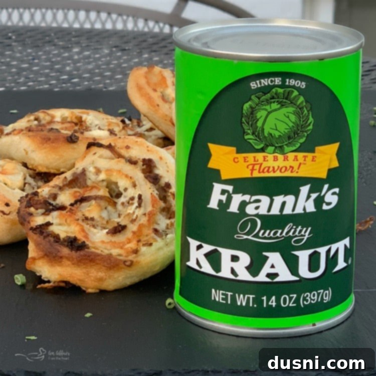 Ingredients for Steak & Kraut Pinwheels laid out, including a can of Frank's Kraut, thinly sliced steak, onions, and cheese