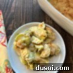 Cheesy Brussels Bake 14 Overhead of Brussels Sprouts Gratin on a white plate