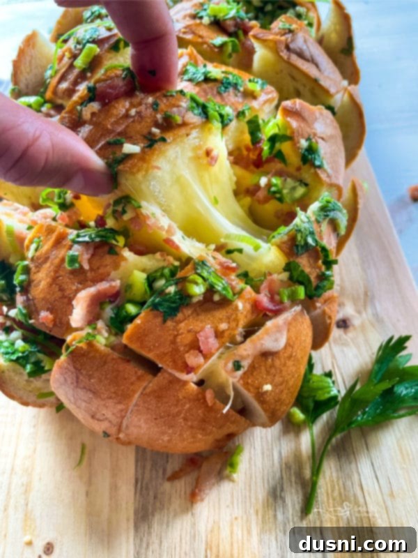Served Cheesy Crack Bread on a cutting board