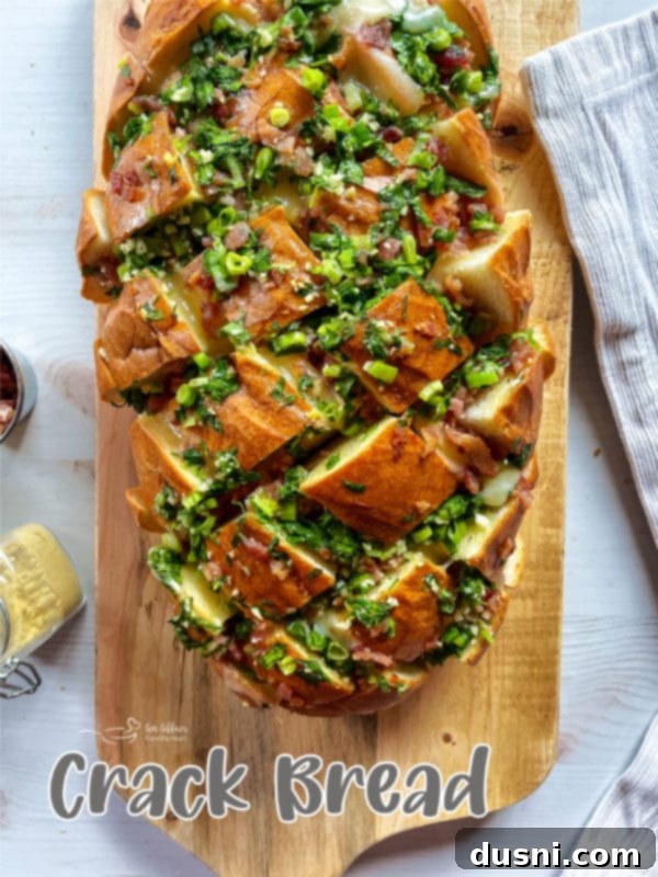 Finished Cheesy Garlic Crack Bread on a serving board